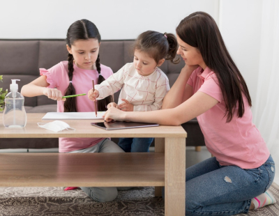 Professional caregiver helping a child build emotional confidence after school at home