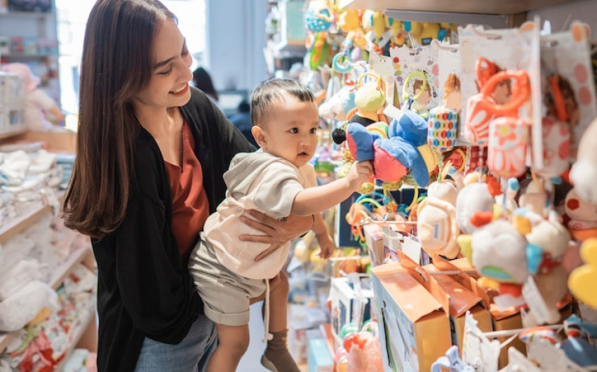 Mall babysitting care area with children playing safely under professional supervision